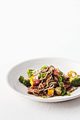 Beef with honey and soy marinade, vegetables and noodles