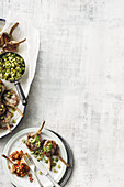 Grilled lamb chops with tomato salsa, and olive and caper salsa