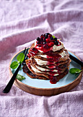 Flapjacks made from maniok flour with cream cheese and berry compote