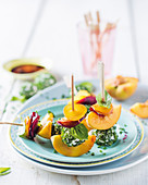 Peach skewers with goat's cheese balls and beetroot
