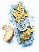Monkfish skewers with lemon sauce