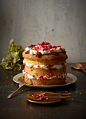 Lemon and mascarpone cake with pecan nuts and pomegranate seeds