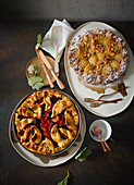 Plum pie decorated with pastry leaves and crumble pie with quince and spice maple syrup