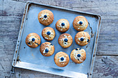 blueberry muffins on a baking tray