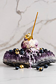 Luxurious blueberry ice cream served on an amethyst