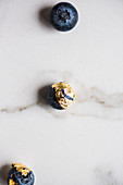 Blueberries with gold leaf