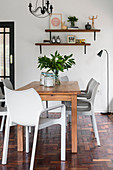 Wooden dining table and designer chairs