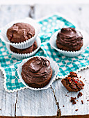 Chocolate cupcakes with cherries and chocolate frosting (gluten-free)