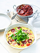 Omelette with chorizo and tomatoes served with chilli beans