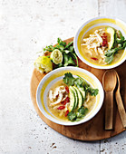 Oriental chicken soup with avocado and lime