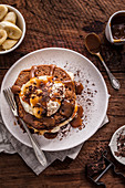 Chocolate and caramel pancakes with bananas