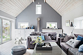 Blue and grey living room with open roof structure