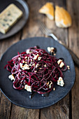 Black bean noodles with beetroot and blue cheese