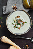 Parsnip soup with a walnut and pear topping