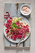 Beetroot pasta with creamy sauce with horseradish and smoked mackrell