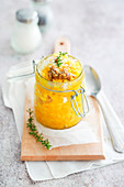Saffron risotto with sausage served in a flip-top jar