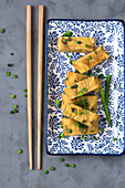 Japanese rolled omlette (Tamagoyaki) with fresh chives (Japan)