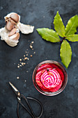 Pickled chioggia beets in a jar (seen from above)