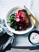 Beef steak with sweet and sour beetroot, chard and horseradish dip