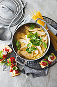 Chicken noodle soup with ciabatta with roasted tomatoes (Italy)