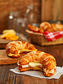 Croissant sandwiches with sliced turkey breast and cheese