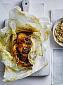 Spicy chicken en papillote with preserved lemons and couscous