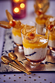Rice pudding with mango purée and physalis for Christmas