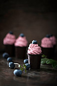 Vegan blueberry cream in chocolate cups