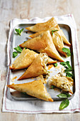 Samosas filled with peas, feta cheese, coriander, pepper and butter