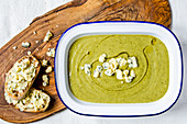Broccoli soup with blue cheese and olive oil, and crostini with blue cheese