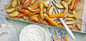Roasted potatoes and vegetables with feta quark