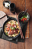 Wok-seared chilli plum steaks with corn fried rice