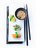 Sweet sushi with a sesame and honey dip