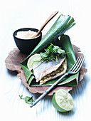 Sea bass in a banana leaf with cauliflower and coconut purée