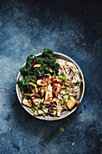 Salmon, kale and mushroom noodle bowl