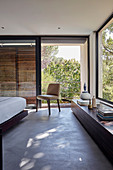 Modern bedroom with panoramic windows and balcony
