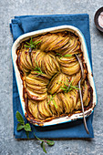 Sliced bake potatoes with herbs, se salt and pepper