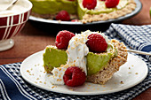 Vegan avocado and lime tart with raspberries