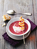 Beetroot soup with a scampi skewer