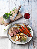 Saddle of venison with caramelised carrots and mashed potatoes with wild mushrooms
