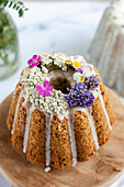 A zucchini and coconut cake decorated with flowers