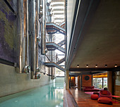 Ducts and stairs above pool in modern architect-designed house