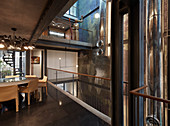 Dining room in architect-designed house with open-plan storeys