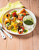 Grilled mini peppers with feta and mint dressing
