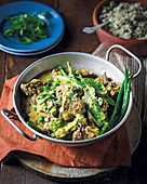 Ostrich curry with coconut milk and green vegetables