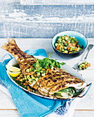 Grilled fish filled with fennel and fruity pineapple salsa