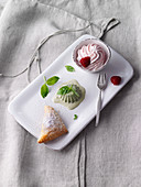 Raspberry foam with basil ice cream and puff pastries