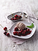 Chocolate ice cream with cherry compote