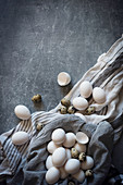 White eggs in a grey cloth linen