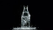 Glass bottle smashing, slow motion
